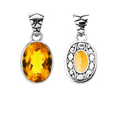Handmade sterling silver pendant with oval-cut Citrine Quartz and artisan scroll back, Bali Quartz jewelry.
